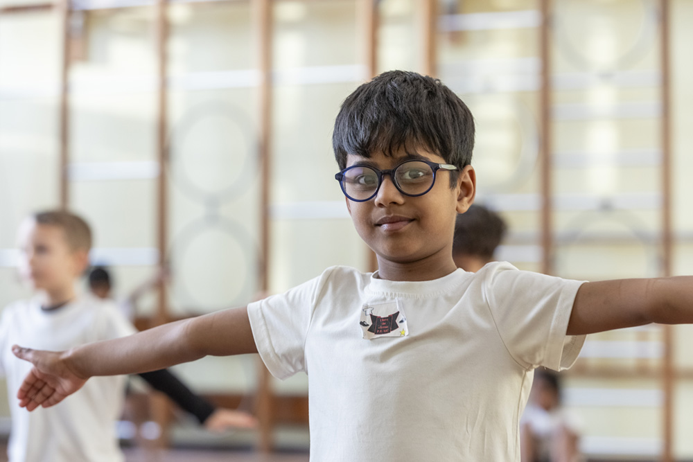 Boy stretching in PE